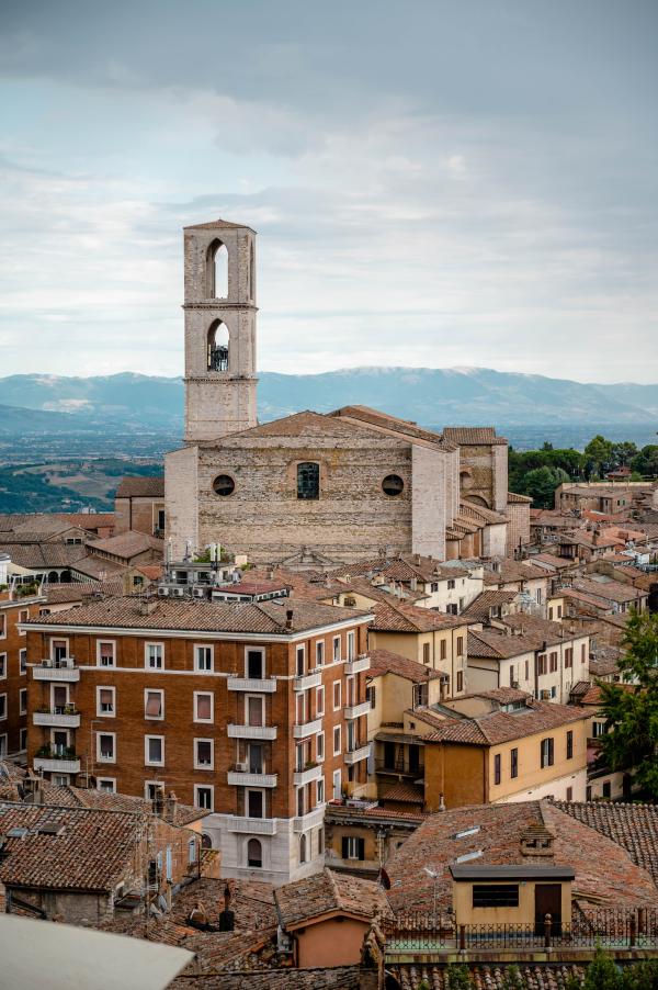 view of San Domenico, nestled in the historic centre of Perugia between alleys and houses.